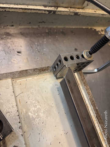 ...one end is butted up against a 123 block that is clamped to the mill's casting well beyond the fixture plate...